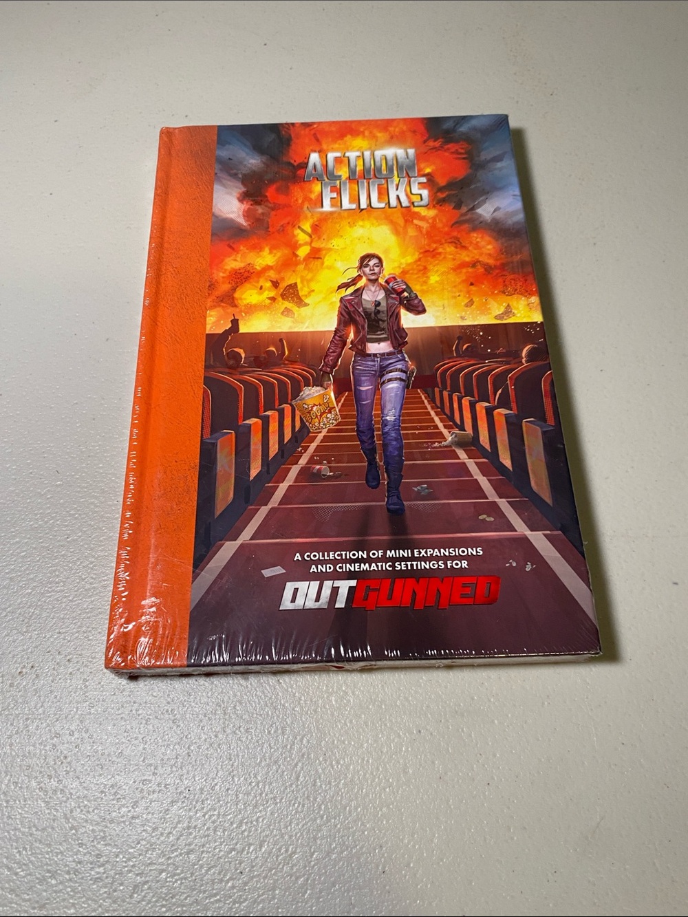 Outgunned: Action Flicks Expansion - Orange Hardcover